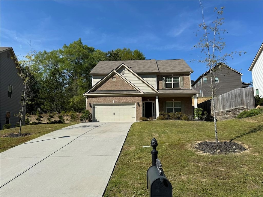 View of front of property with a garage and a fron