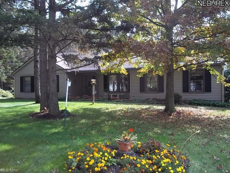 Front/side view with the flower beds