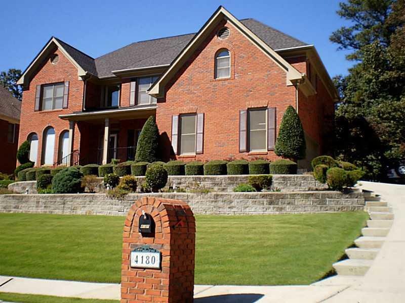 Exterior Front. Home is situated on the high side 