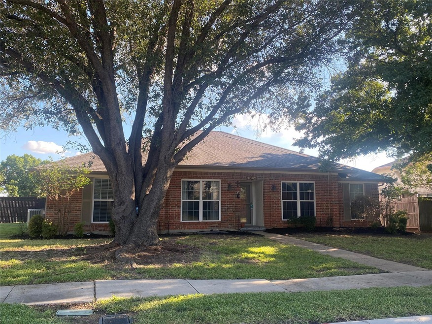 Single story home featuring a front yard