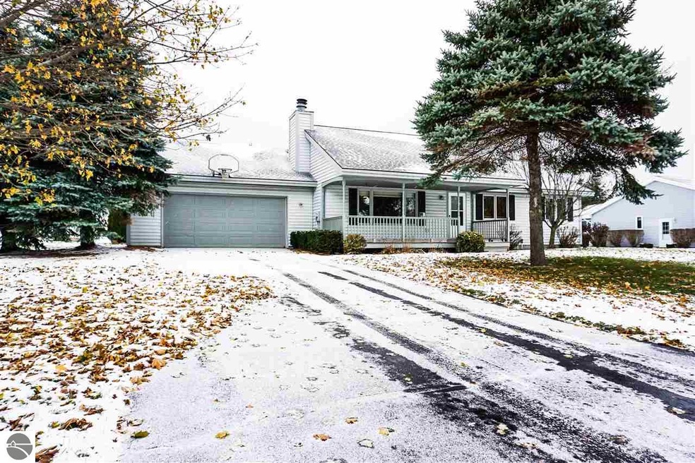The mature landscaping of the front yard
