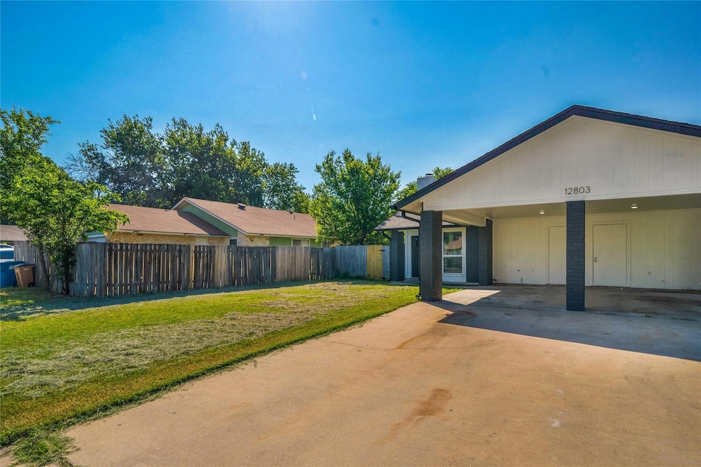 View of front of home with fence, a carport, conc