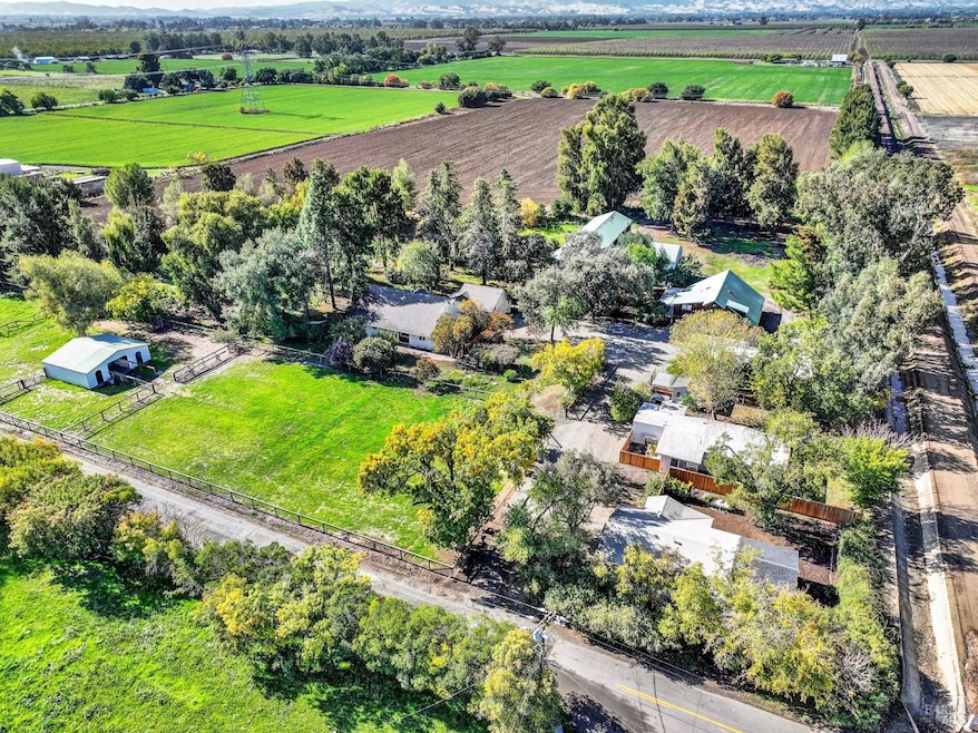 Expansive nearly 20-acre property featuring 4 charming dwellings, lush mature trees, and ample usable acreage. A rare opportunity to own a versatile, private estate with endless possibilities