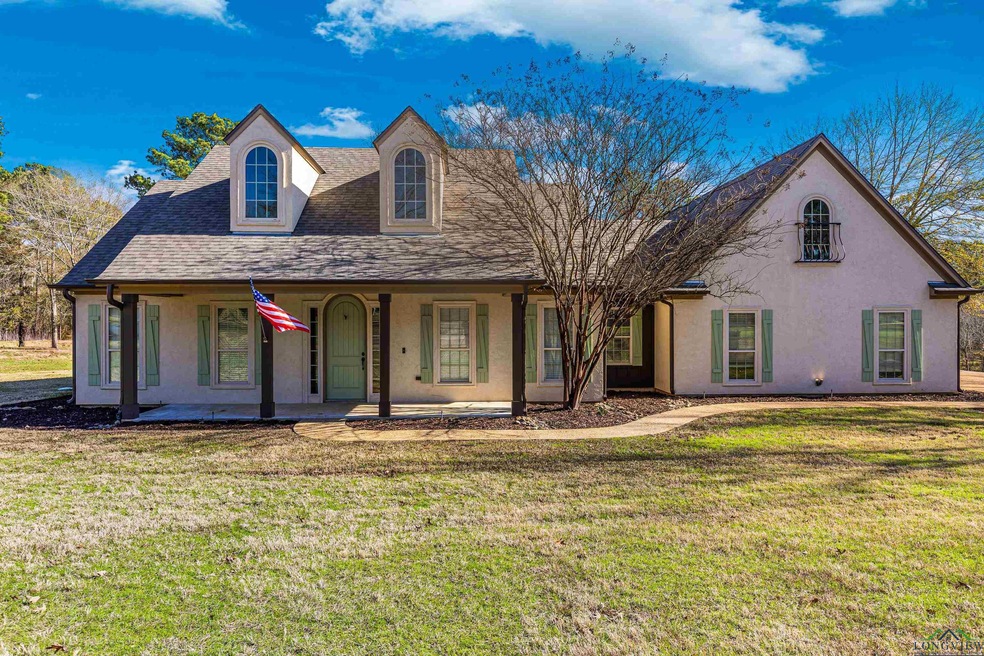 View of front of house featuring covered porch and