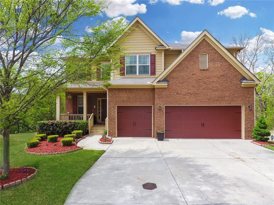 GORGEOUS HOME WITH LUSH LAWN AND THREE CAR GARAGE 