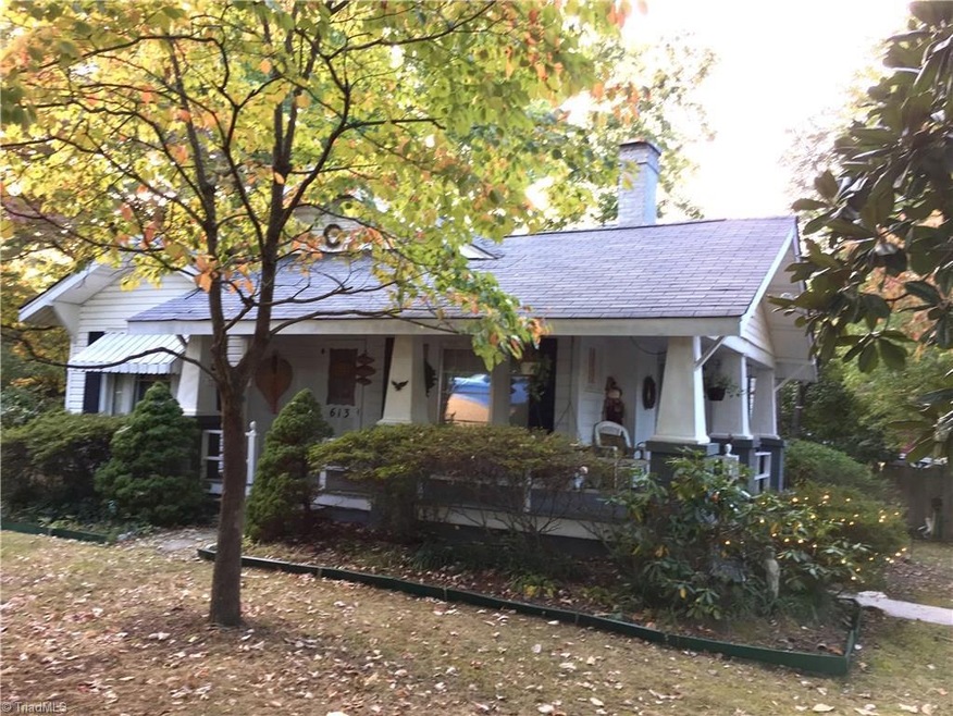 Sitting on almost 1.5 acres, this home has a big covered front porch, and a beautiful, shady yard.