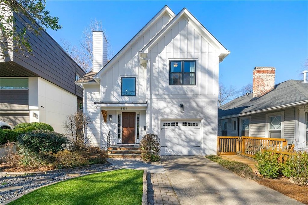 View of front of home featuring front door with si