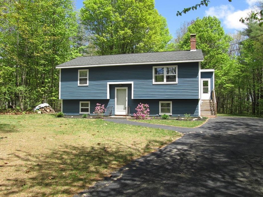 Well landscaped with paved walk way.