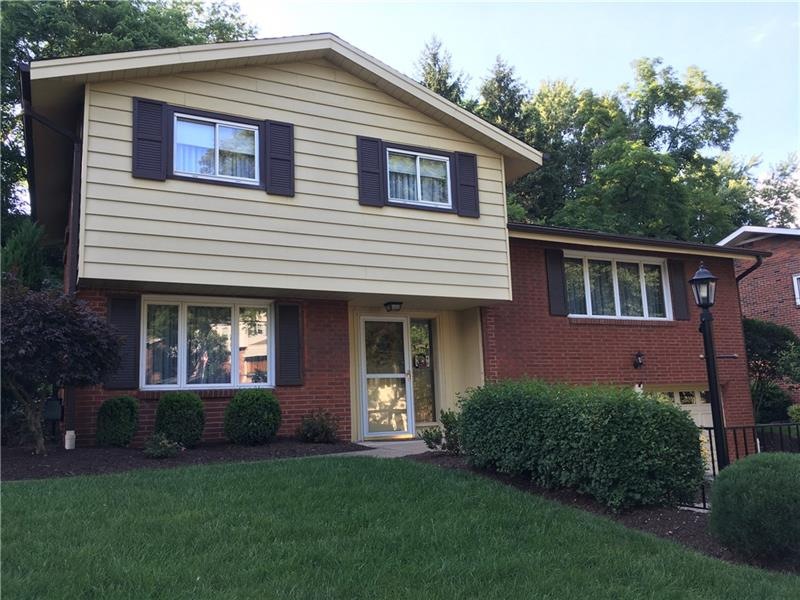 Pristine and freshly landscaped yard will welcome 