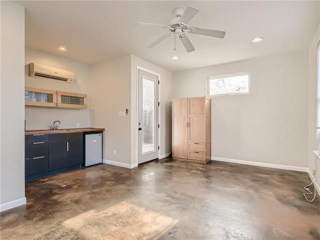 Cute efficiency with stained concrete floors, kitc