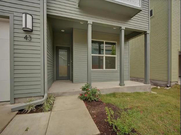 Entrance to property with covered porch