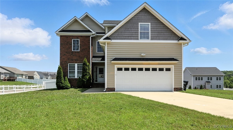 View of front facade featuring concrete driveway,