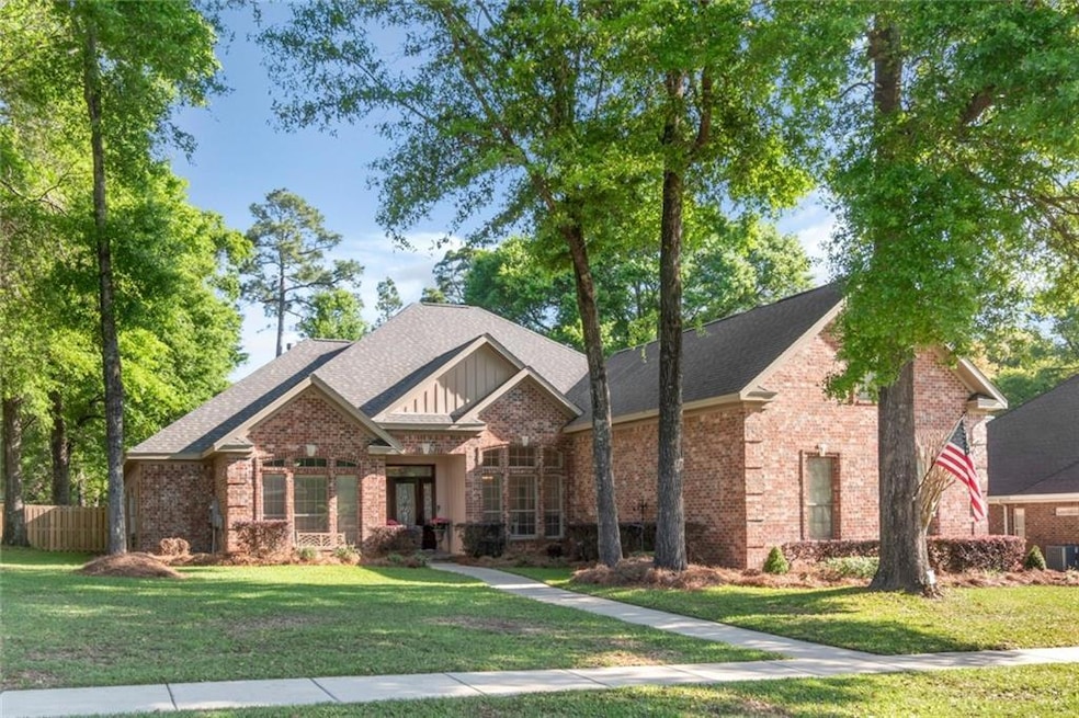 View of front of home with brick siding, a front l