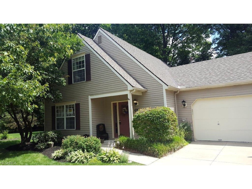front view of home w two car garage, end unit on c