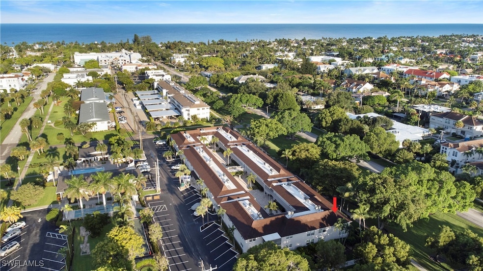Aerial overview of property's location featuring nearby suburban area and a large body of water
