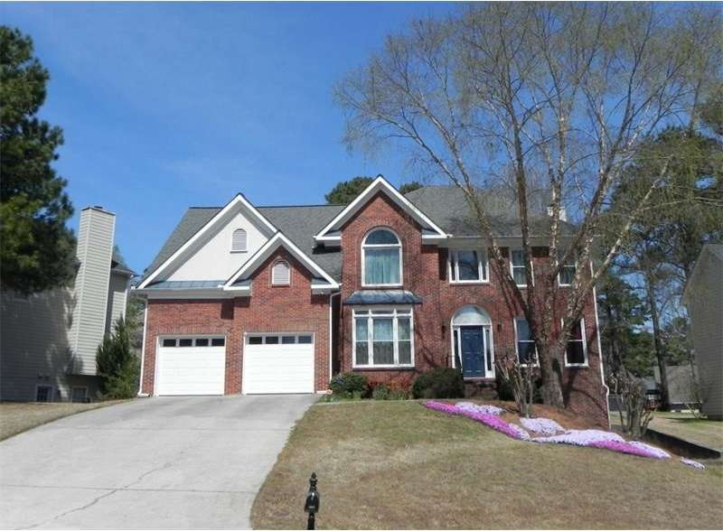 Two Story Brick faced traditional Home with new ca