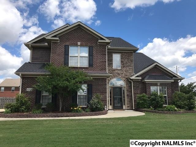 Full brick home on a corner lot with a two car side-entry garage.