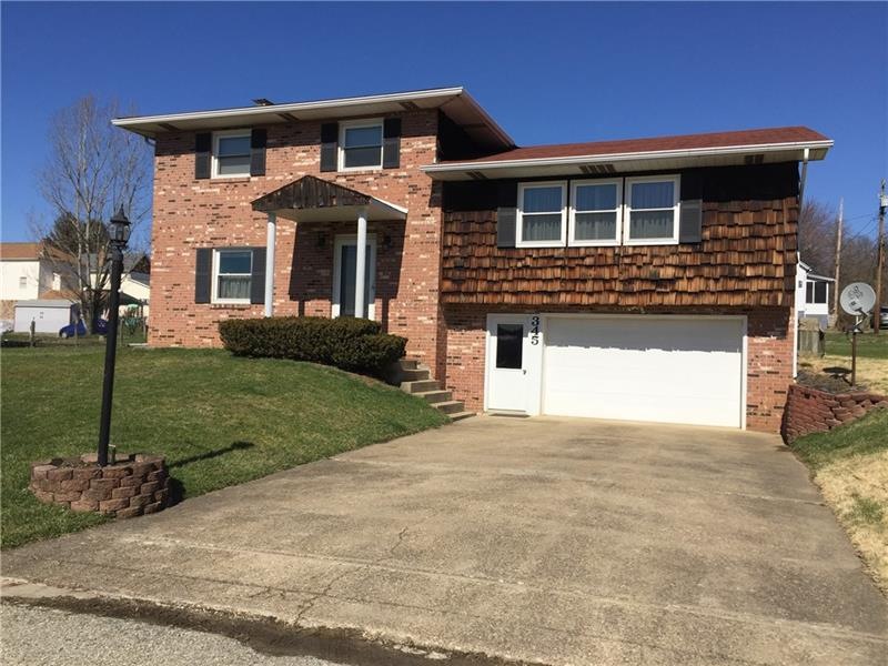 Front of Home  with concrete driveway.