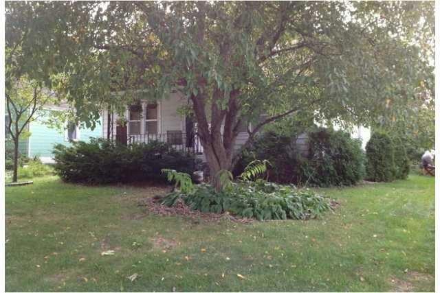 Exterior Front. Outstanding bungalow is a gardners