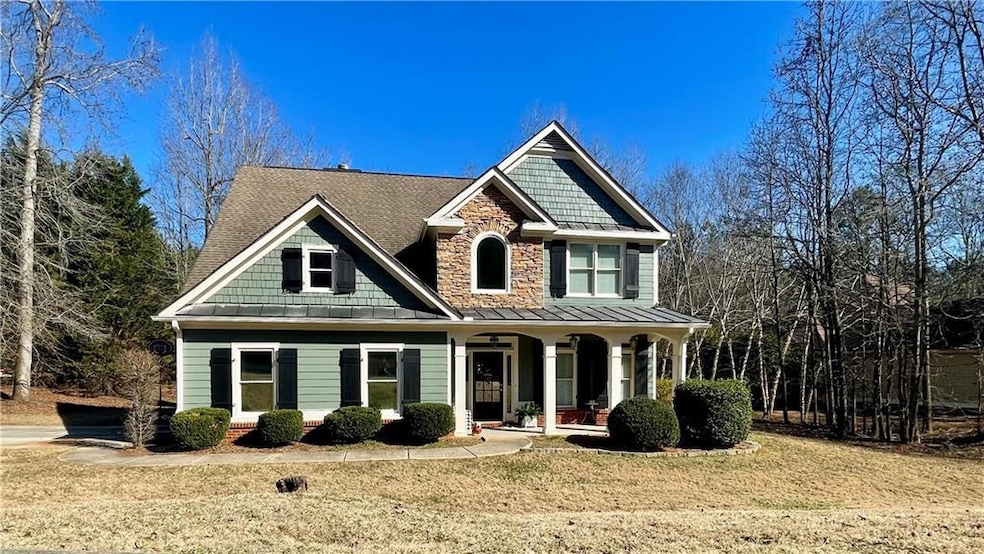 Craftsman-style house featuring a porch, a standin
