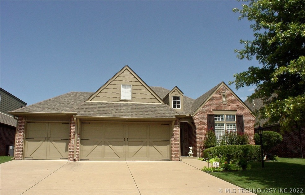 front elevation with established shade trees and b
