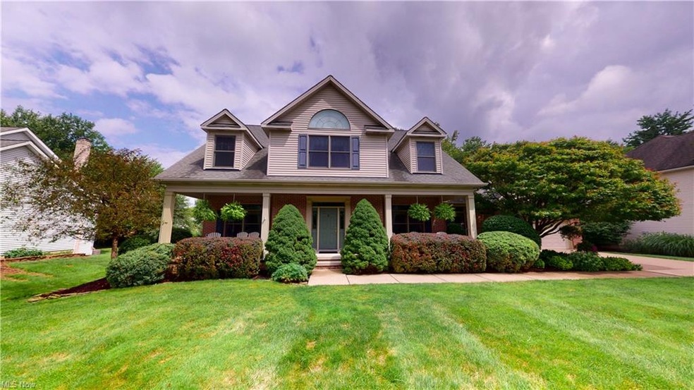 Cape Cod home with well manicured lawn & exterior 