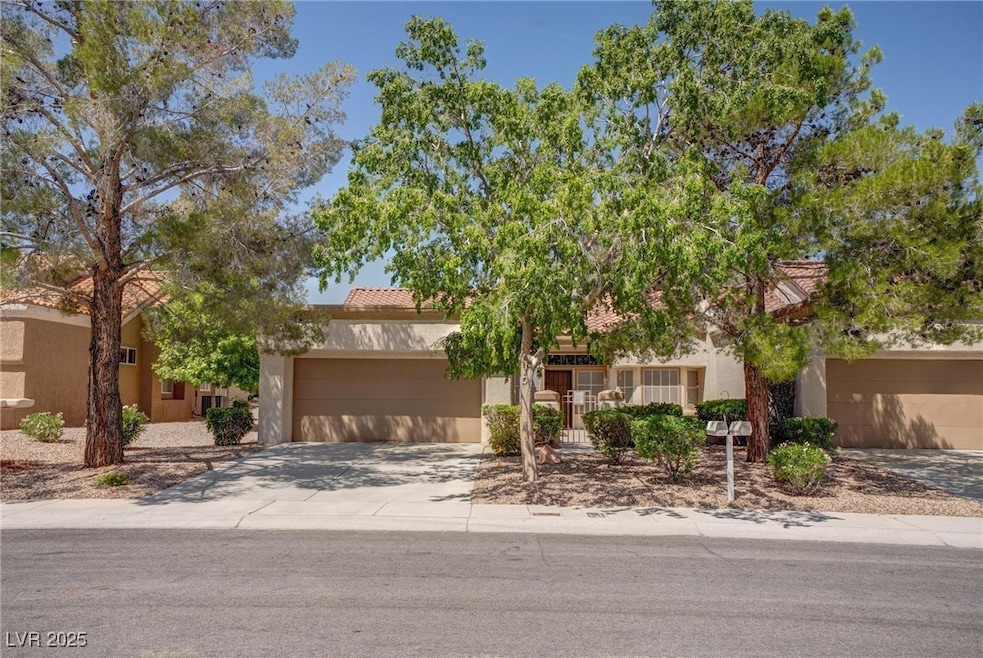 View of front of property featuring concrete drive