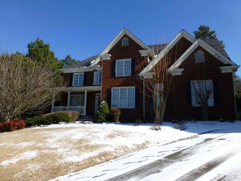 Exterior Front. Beautiful 3-sides brick home nestl