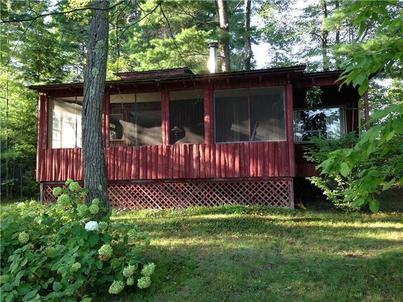 Exterior Front. The screened in...