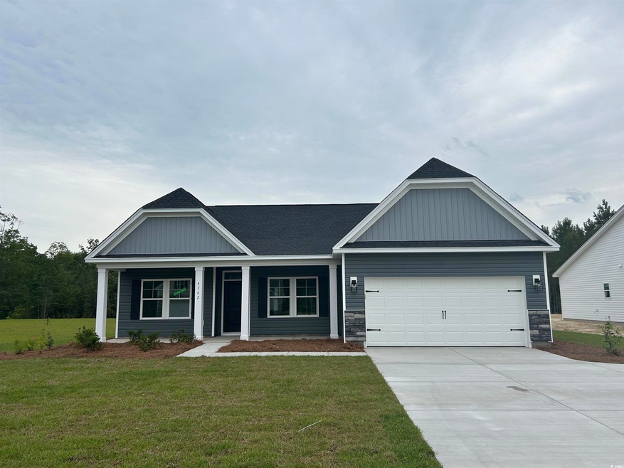 Ranch-style home with an attached garage, a front 