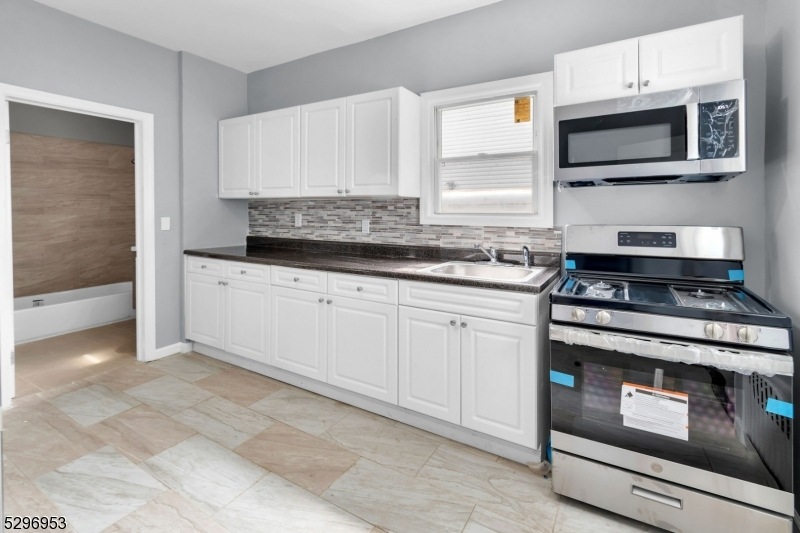 82 Shaw Ave, Newark, NJ 07112 - photo 1