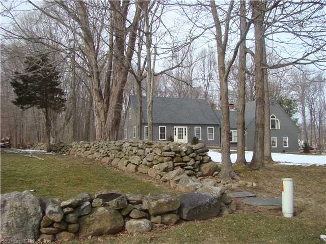 Exterior Front. Beautiful stone walls bordering  h