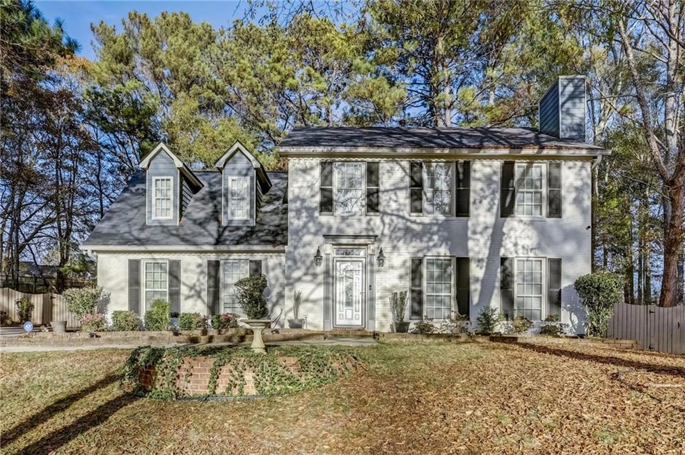 Colonial home featuring a front yard
