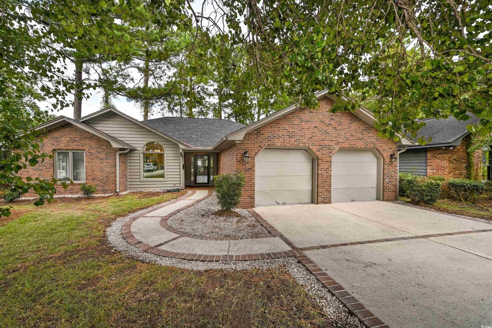 Ranch-style home featuring a garage