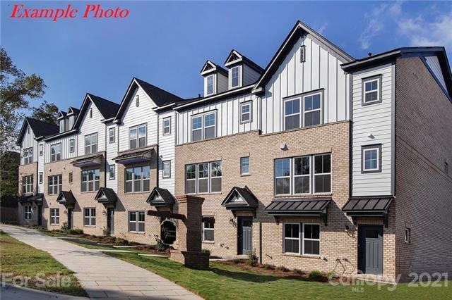 Beautiful front entrance featuring partial brick a