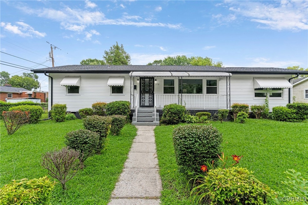 View of front facade with a front lawn and roof wi