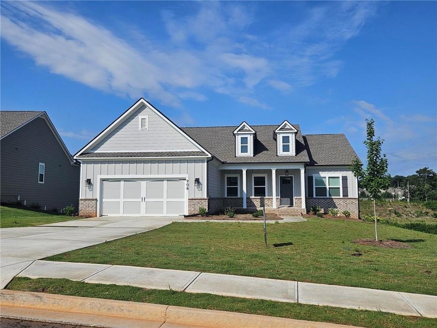 View of front of property with a front lawn and a 