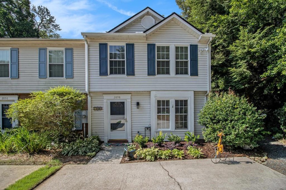 End unit, private garden oasis townhome in the heart of Dresden Square!