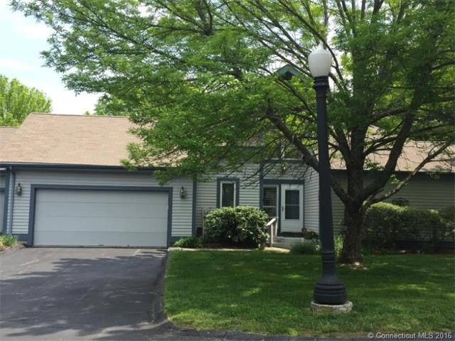 End unit with attached 2 car garage and first floo