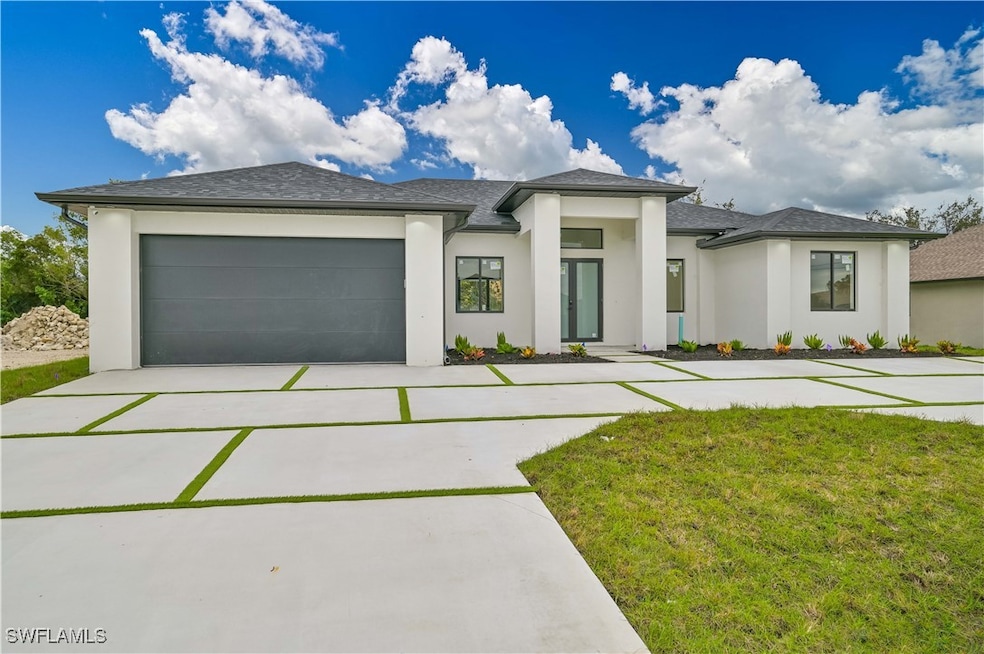 Prairie-style house featuring a front lawn, concre