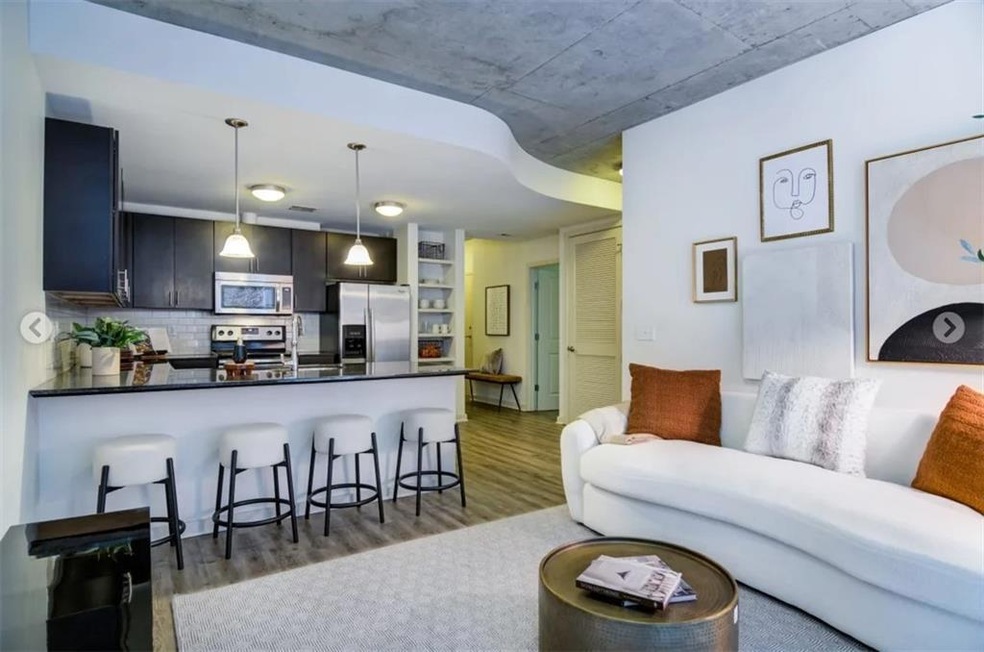 Living room with dark hardwood / wood-style floors