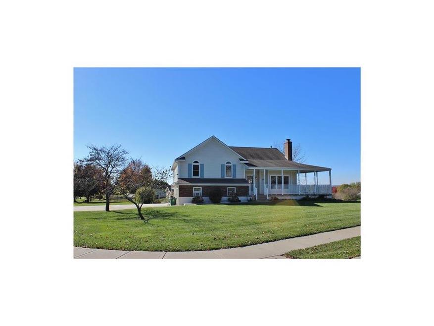 Front view of this lovely home with a wrap around 