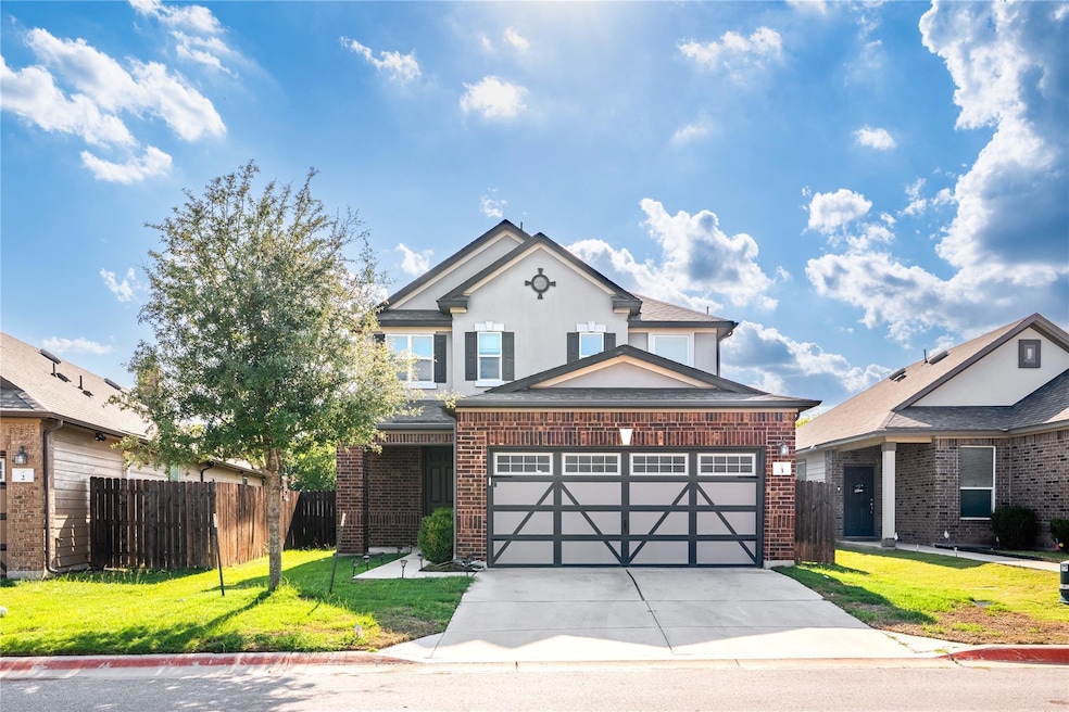 Traditional home with brick siding, driveway, an 