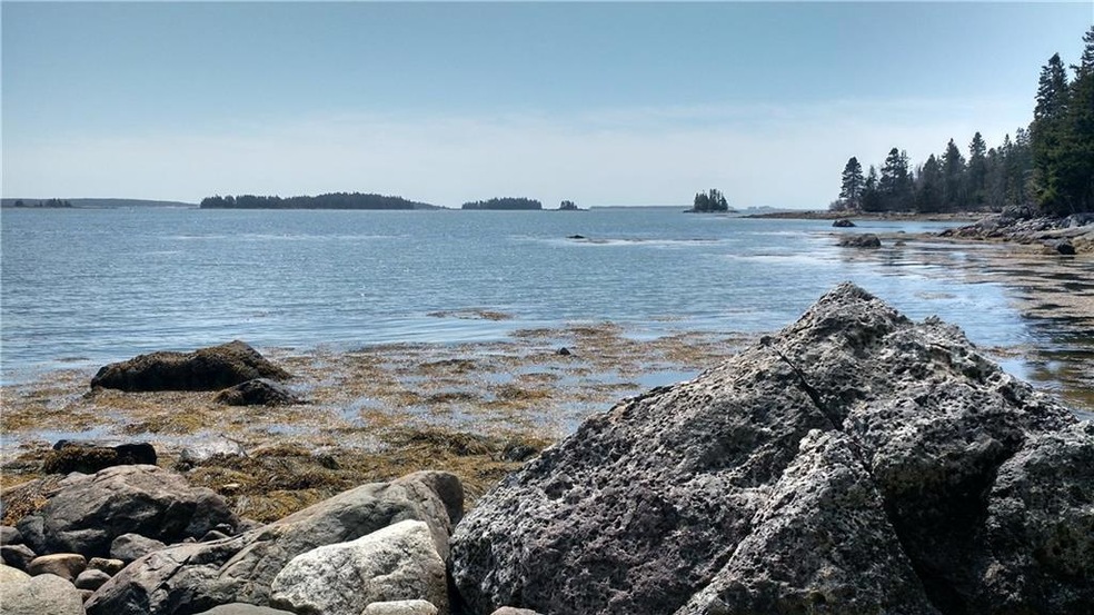 View from the rocky shore looking...