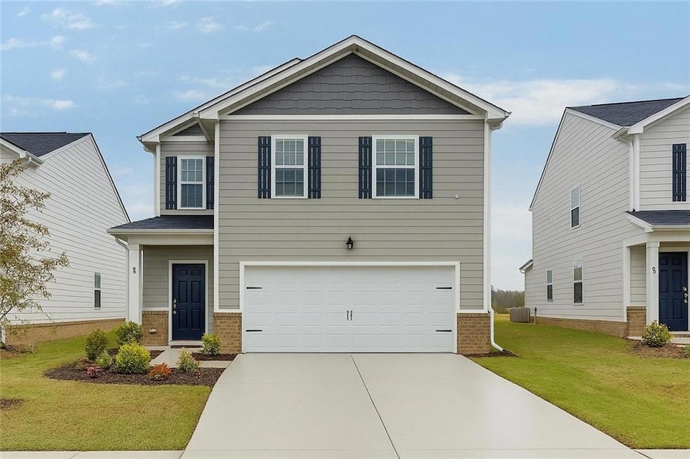 Craftsman-style house with a garage, central AC, a