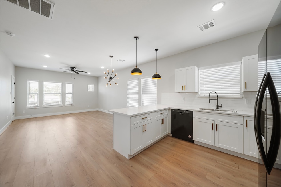 Photos of different duplex by builder to show floo