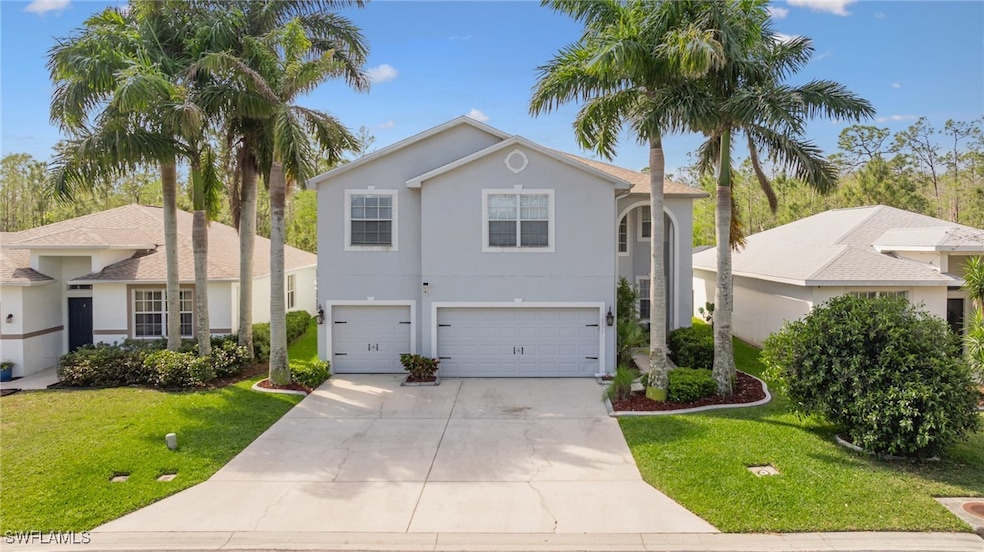 View of front of home featuring stucco siding, an