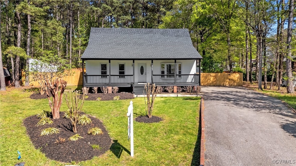 View of front of house featuring roof with shingle