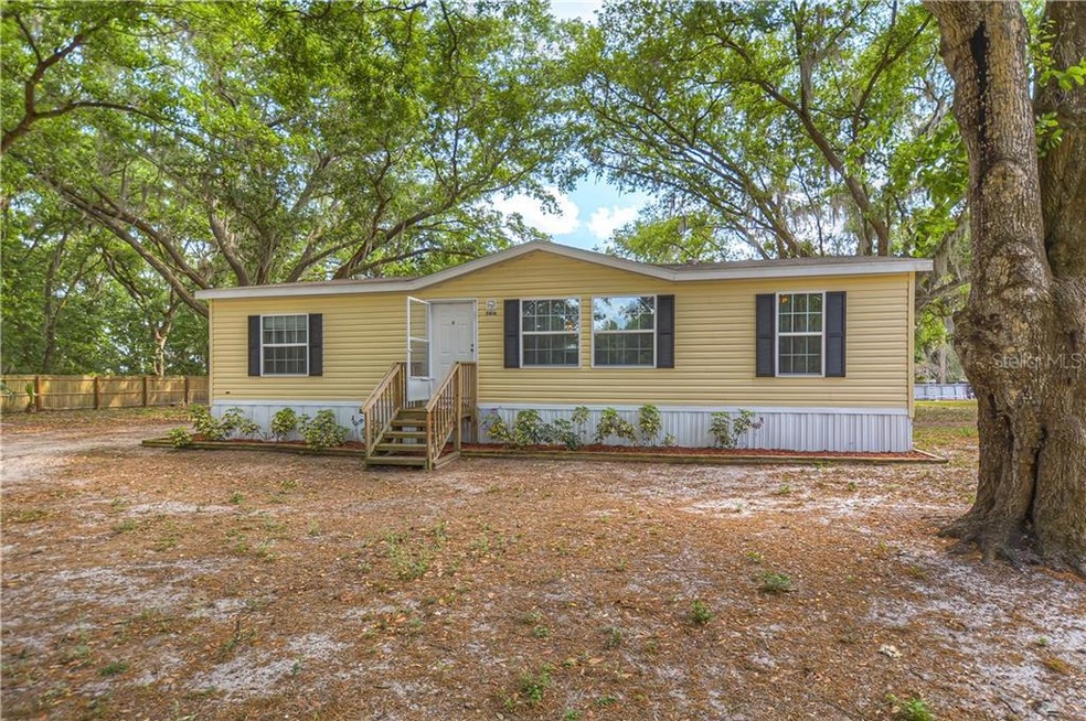 Sitting on a quiet road in rural Lithia, this home is located on an oversized lot of 1-acre and zoned for agriculture!