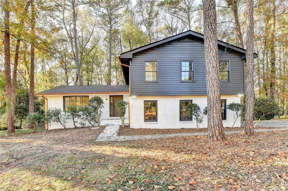 Split level home with brick siding